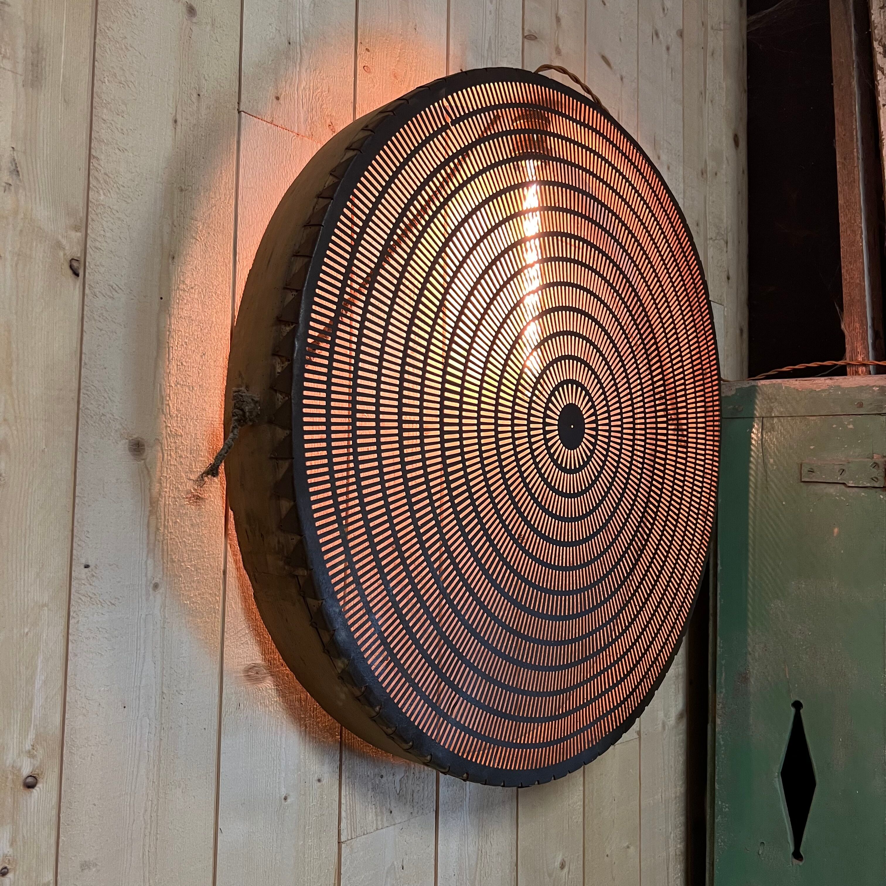 Old lamp in wood and metal worked with integrated lamp.