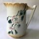Antique barbotine pitcher with floral decoration numbered 548