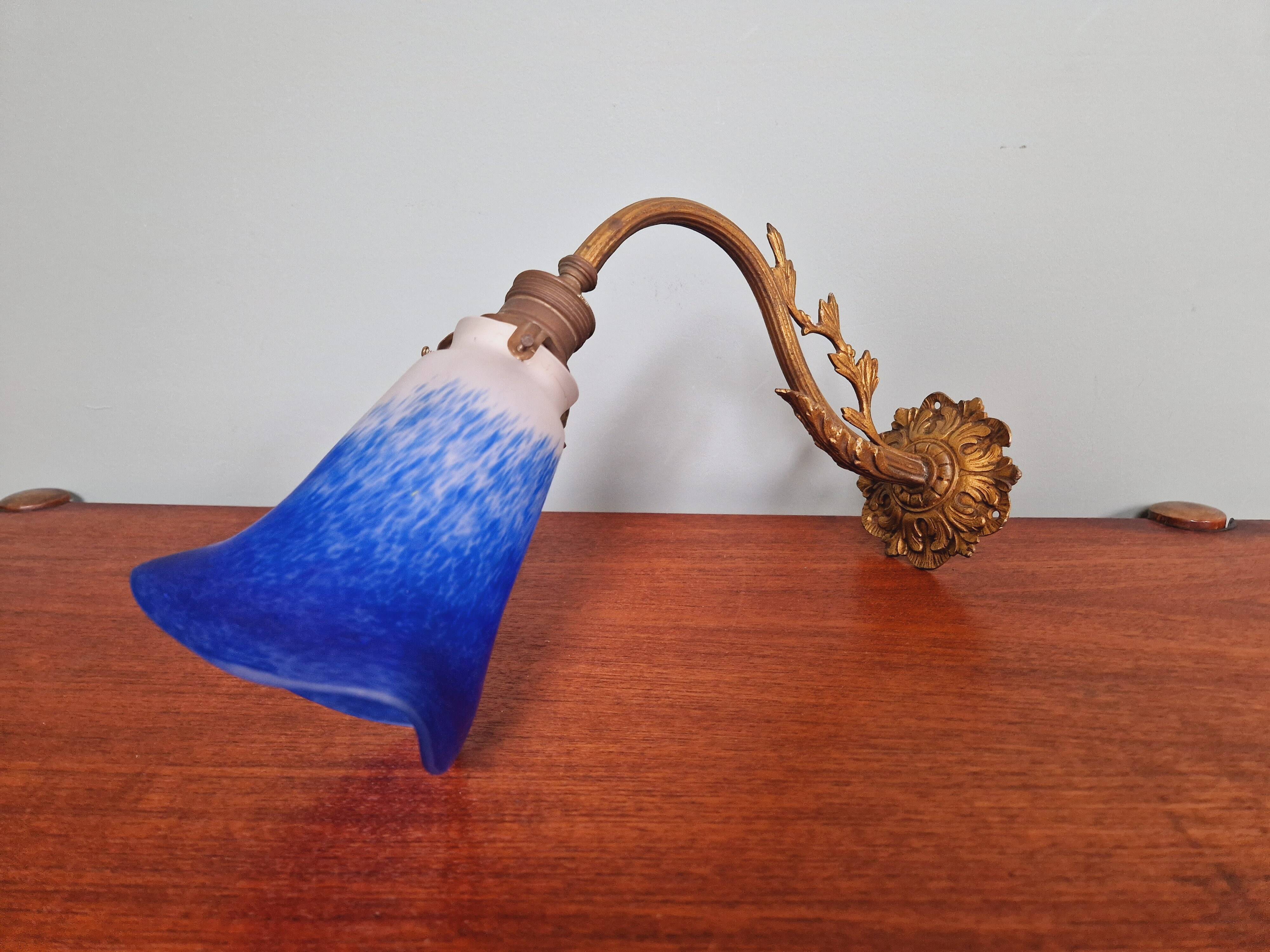 Wall light in gilded bronze and blue marmoreal glass, early 20th century