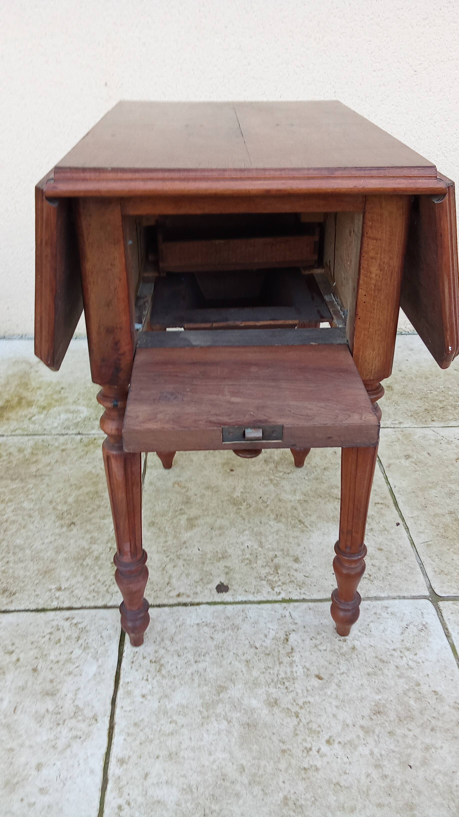 Antique small drop-leaf table from the 19th century.
