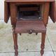 Antique small drop-leaf table from the 19th century.