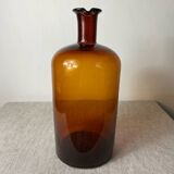 Large amber glass apothecary bottle with spout