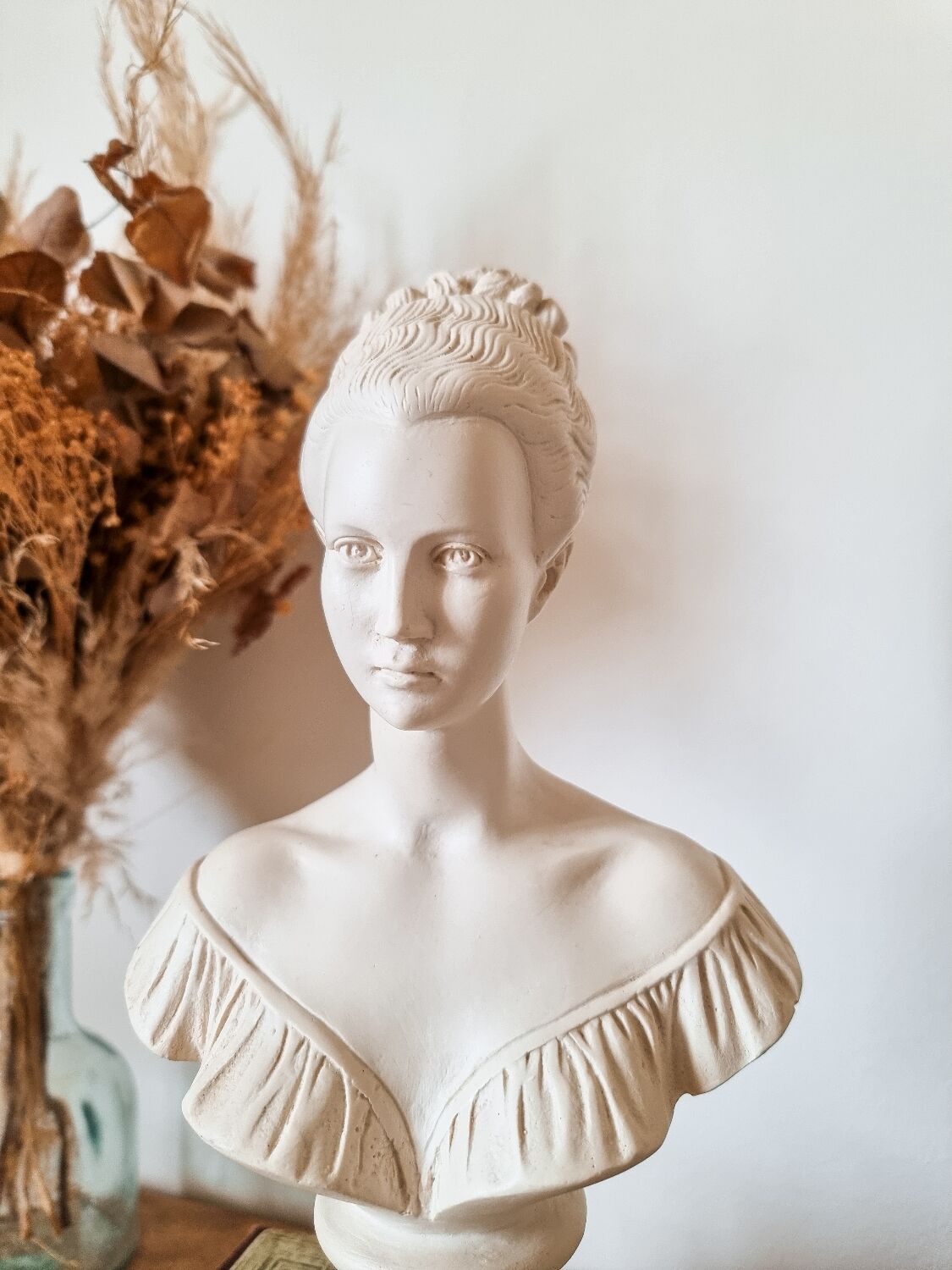 Resin women's bust, signed F.G.