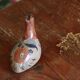 Ancient Mexican bird statue in ceramic