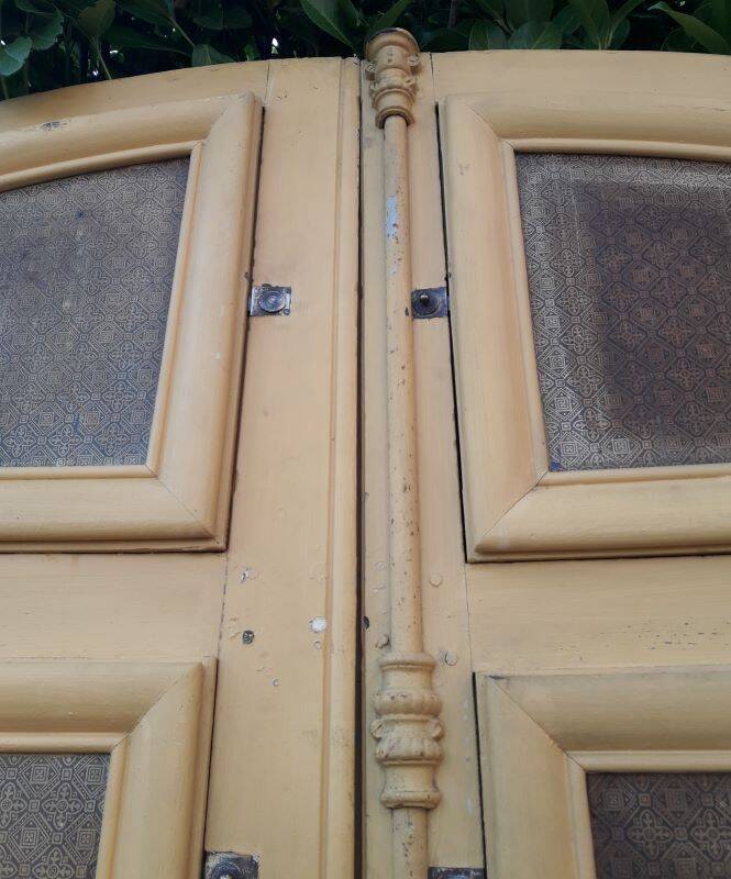 19th century double arched entrance door in oak with grilles and old glass