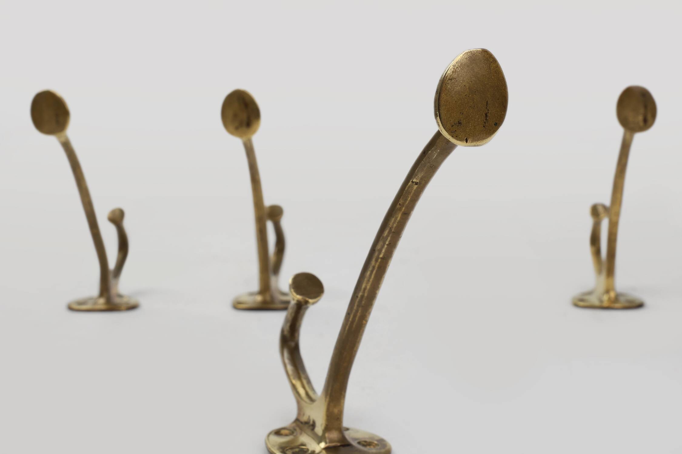 Set of 4 Adolf Loos brass art nouveau wall hooks, Vienna, Austria ca. 1910