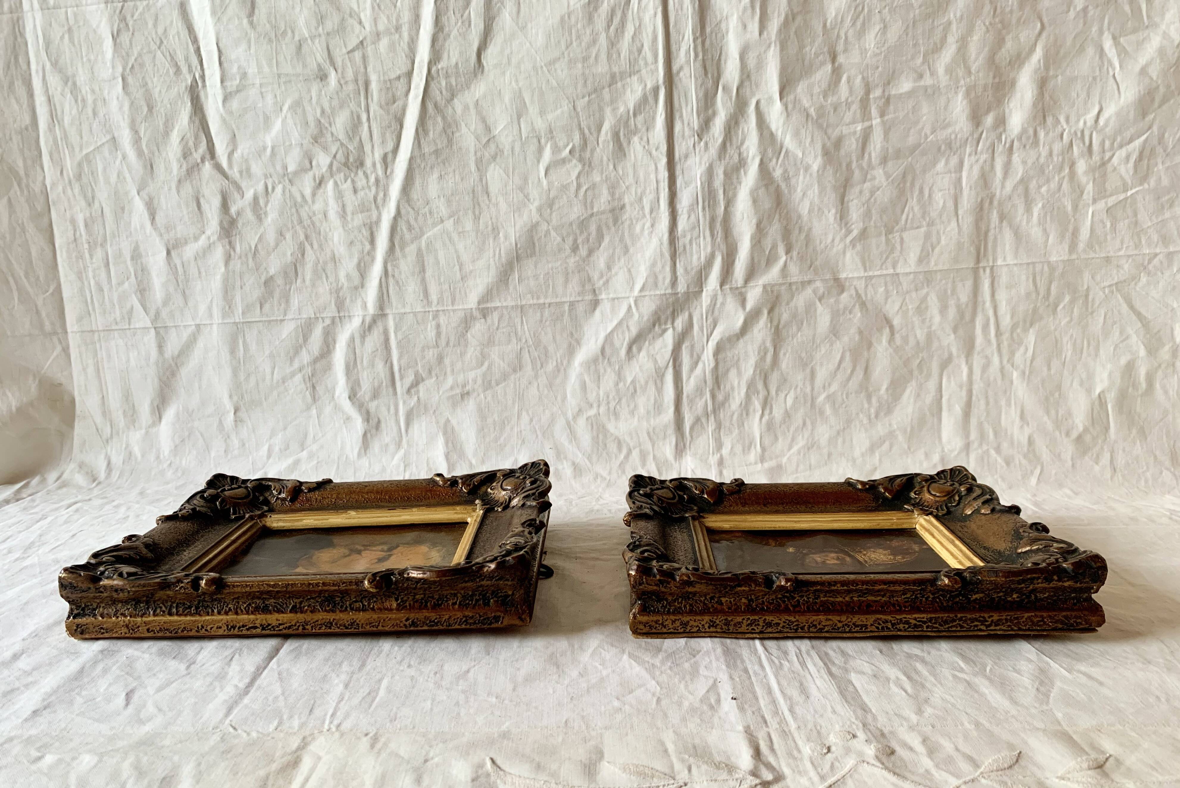 Pair of old carved wooden and plaster frames