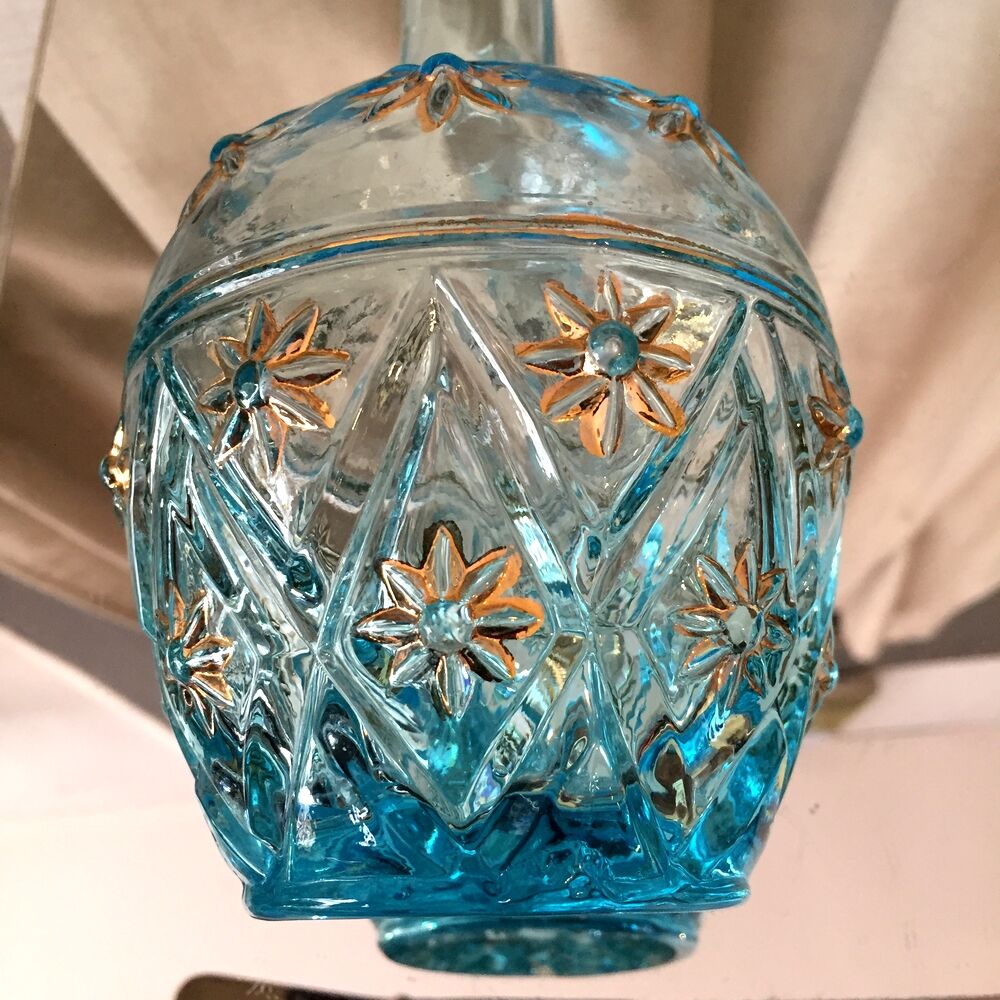 Turquoise blue liquor decanter and glass gild mold press of the 1950s