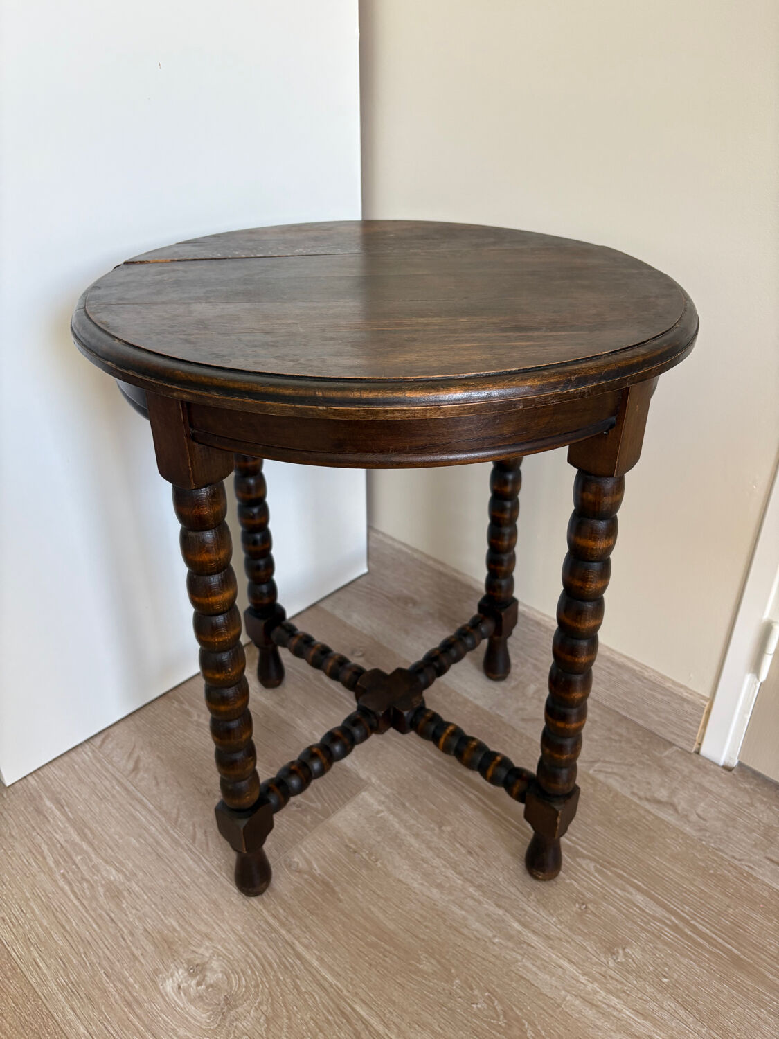 Antique turned wooden side table with authentic charm.
