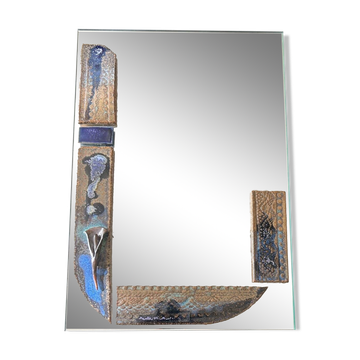 Mirror with ceramic inclusion