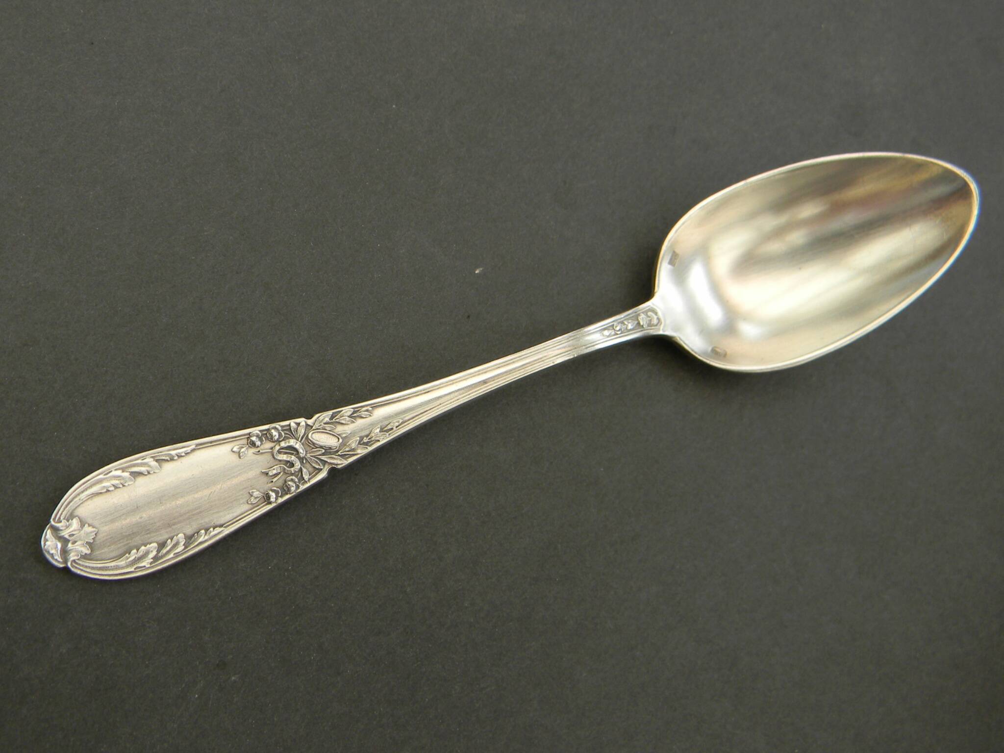 Set of 11 SFAM silver metal teaspoons.