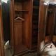 Large English-style wardrobe with a curved front and three doors.