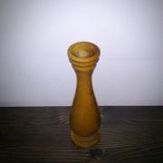 Brown wooden vase from the 1940s, turned, with an elongated silhouette and moulded base.