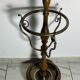 Umbrella stand and English-style wooden and brass canes, 20th century.