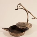 Old oil lamp in golden brass to hang