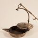 Old oil lamp in golden brass to hang