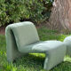 Green armchairs designed by Étienne Fermigier