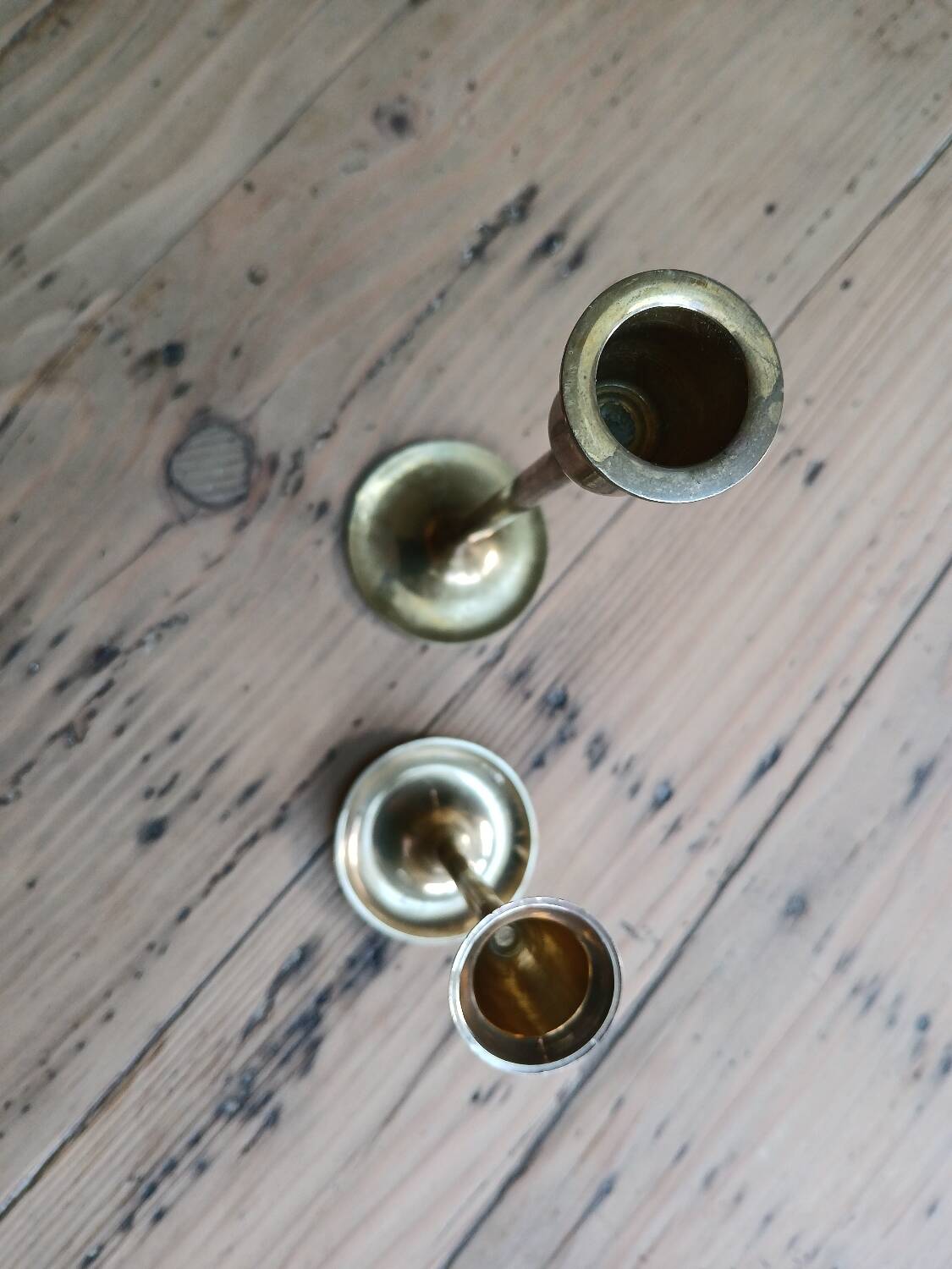 Set of two straight brass candlesticks.