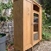 Asymmetrical Art Deco glass-fronted Parisian wardrobe in raw oak, 1930.