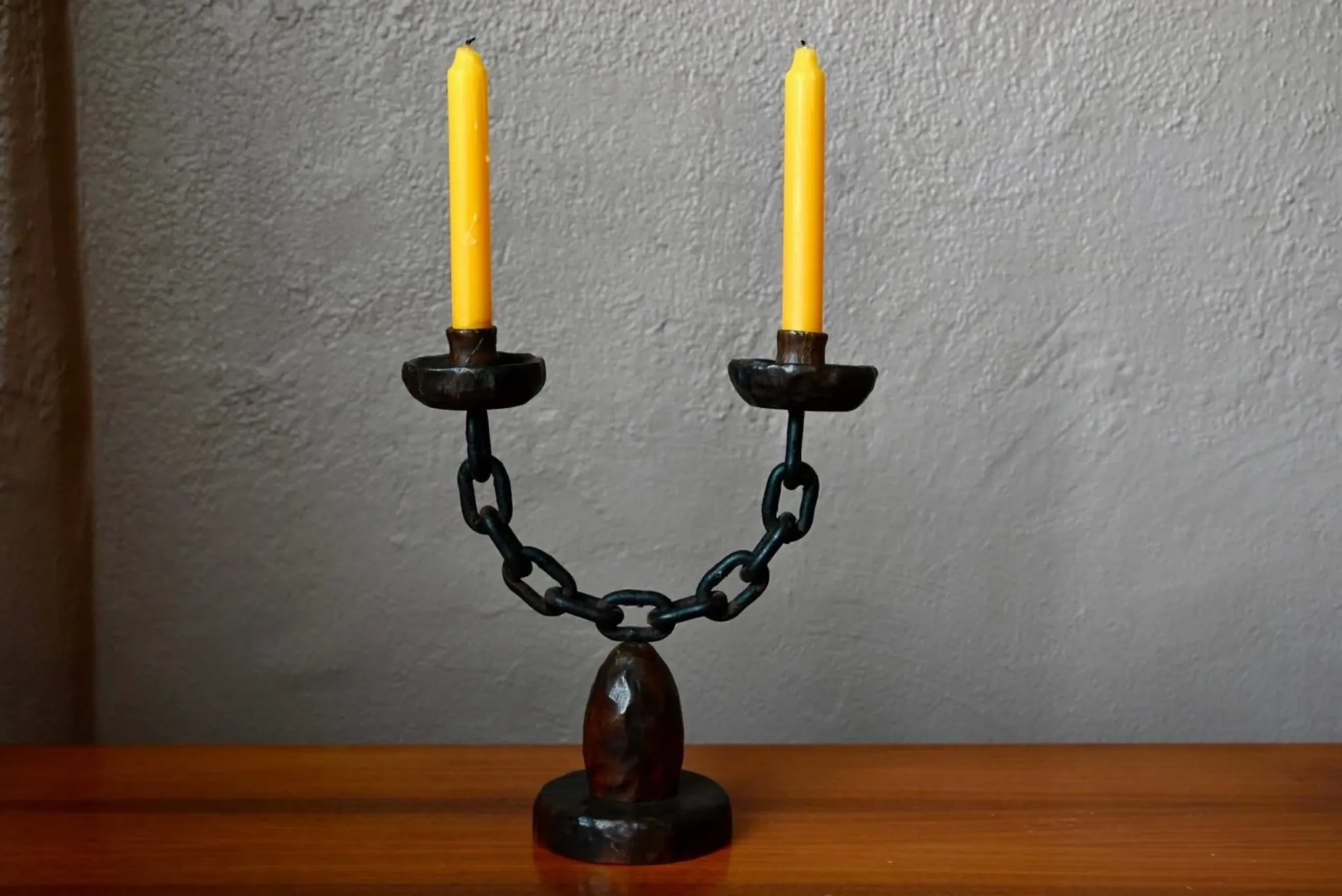Sculpted wooden and wrought iron brutalist double chandelier from the 1960s.