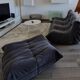 Togo 3-seater sofa by ligne roset with an ottoman.