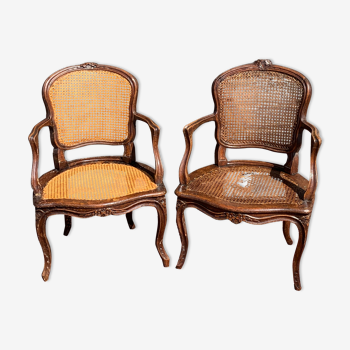 Pair of caned convertible armchairs Louis XV period