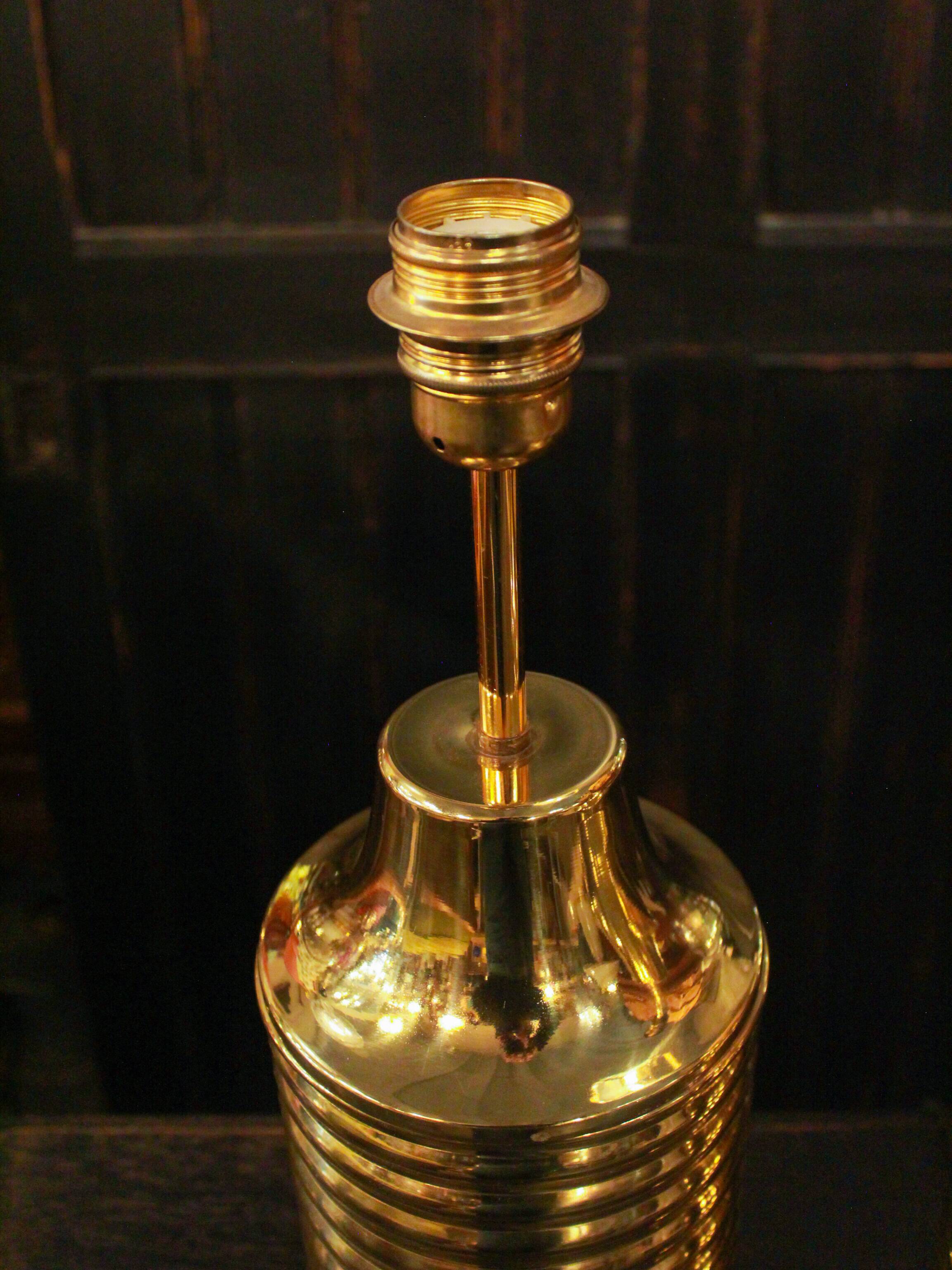 Pair of lamps in gilded brass