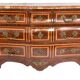 Tomb-shaped commode in Louis XV style with decoration featuring Spanish figures.