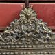 Old repoussé brass pareclose mirror