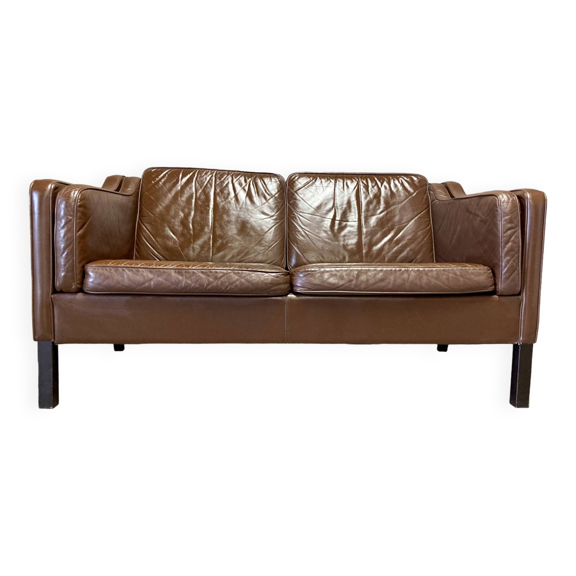 Scandinavian design 2-seater leather sofa.