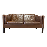 Scandinavian design 2-seater leather sofa.