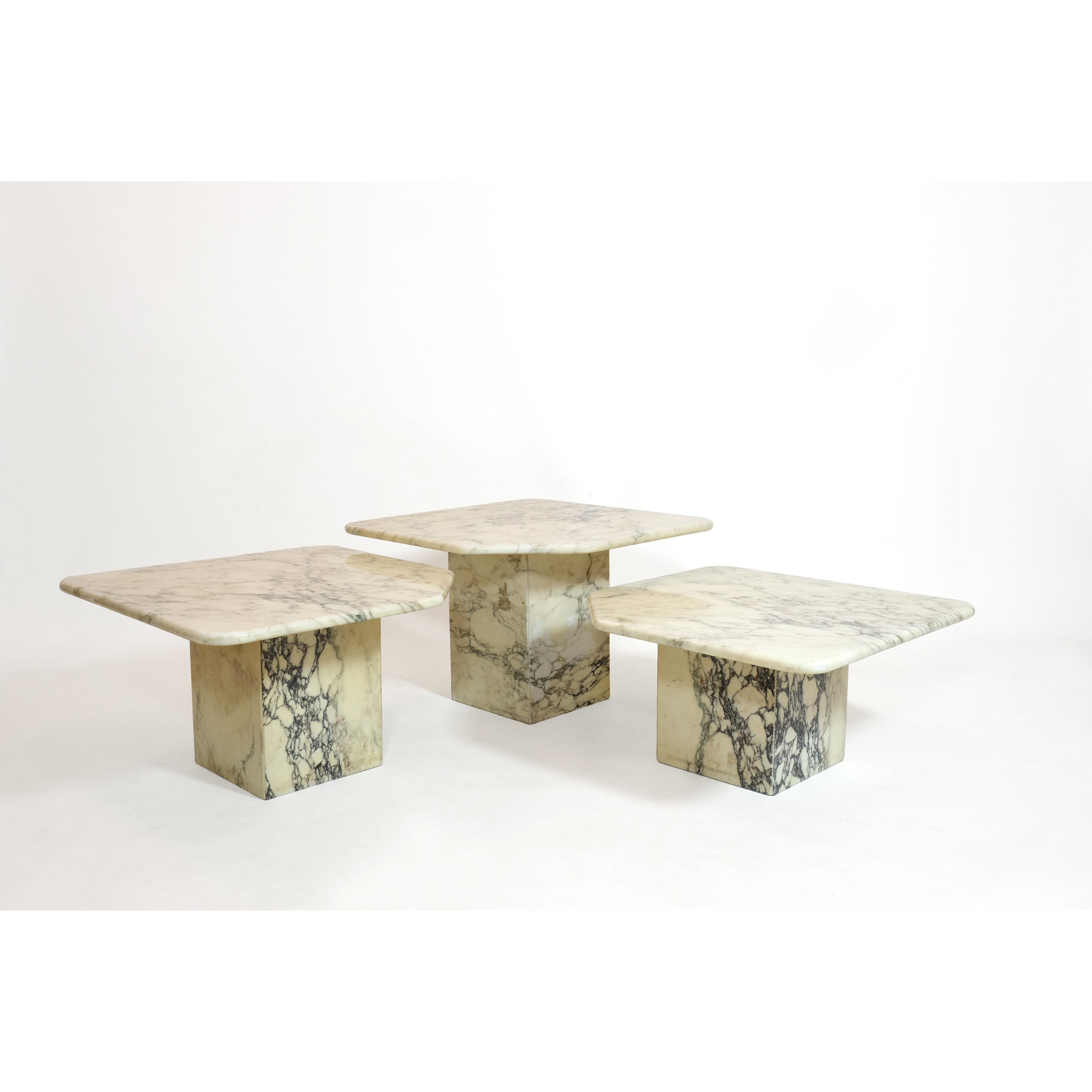 Suite of three marble trundle tables, 1970s