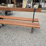 Antique double garden bench from the city of Paris in cast iron and wood