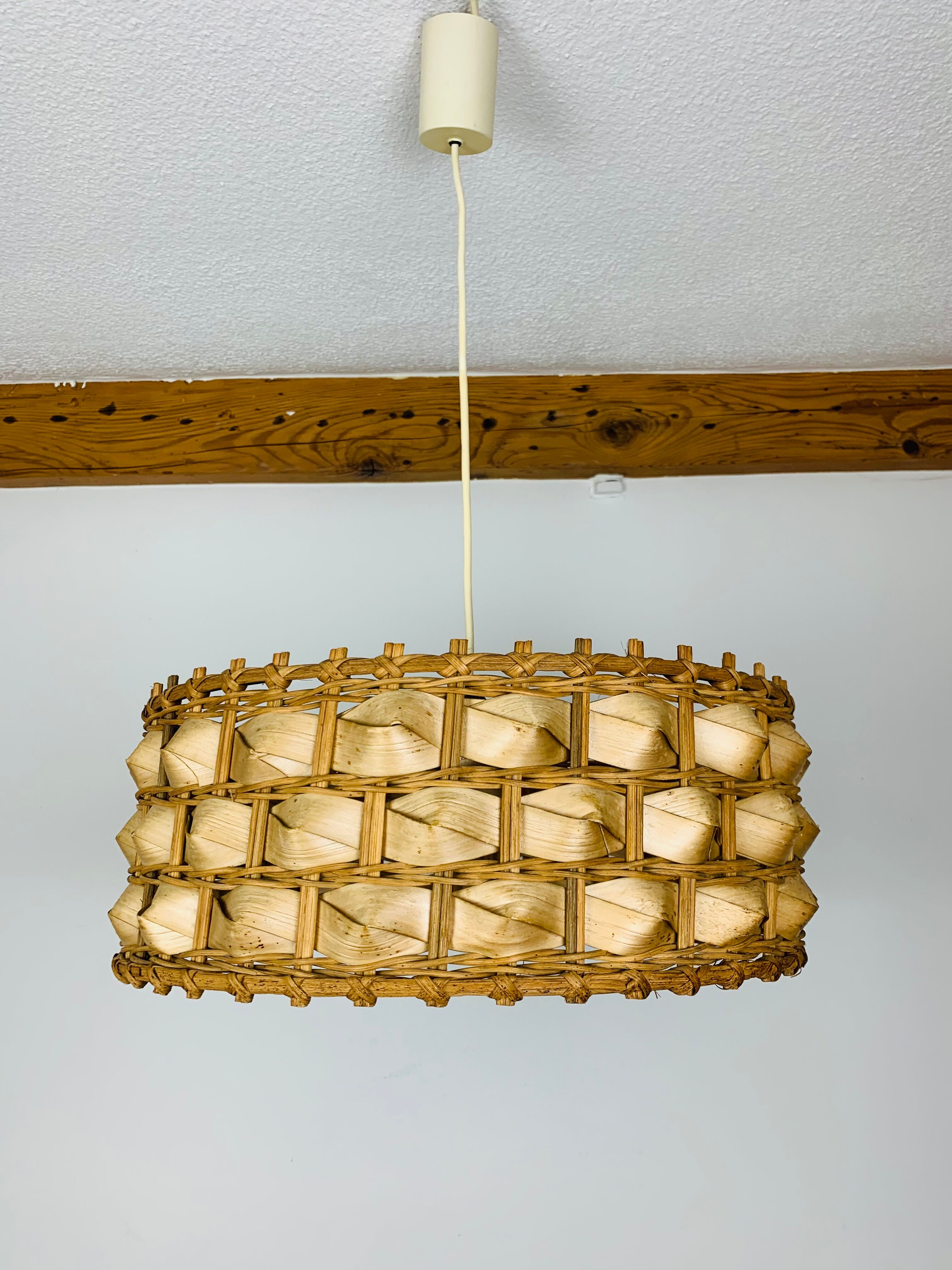 Suspension rattan and palm leaves chic jungle style