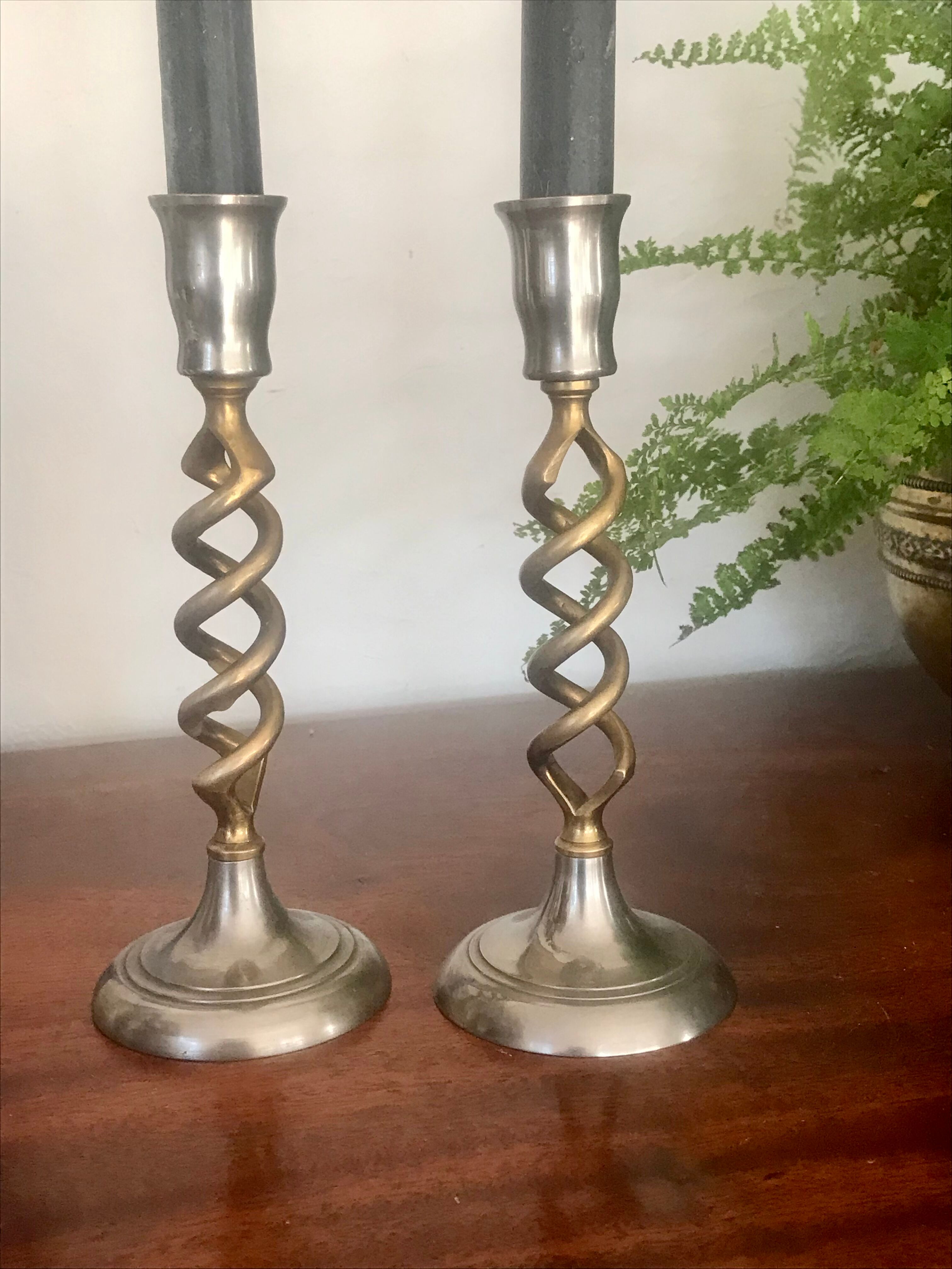 Pair of twisted brass candle holders