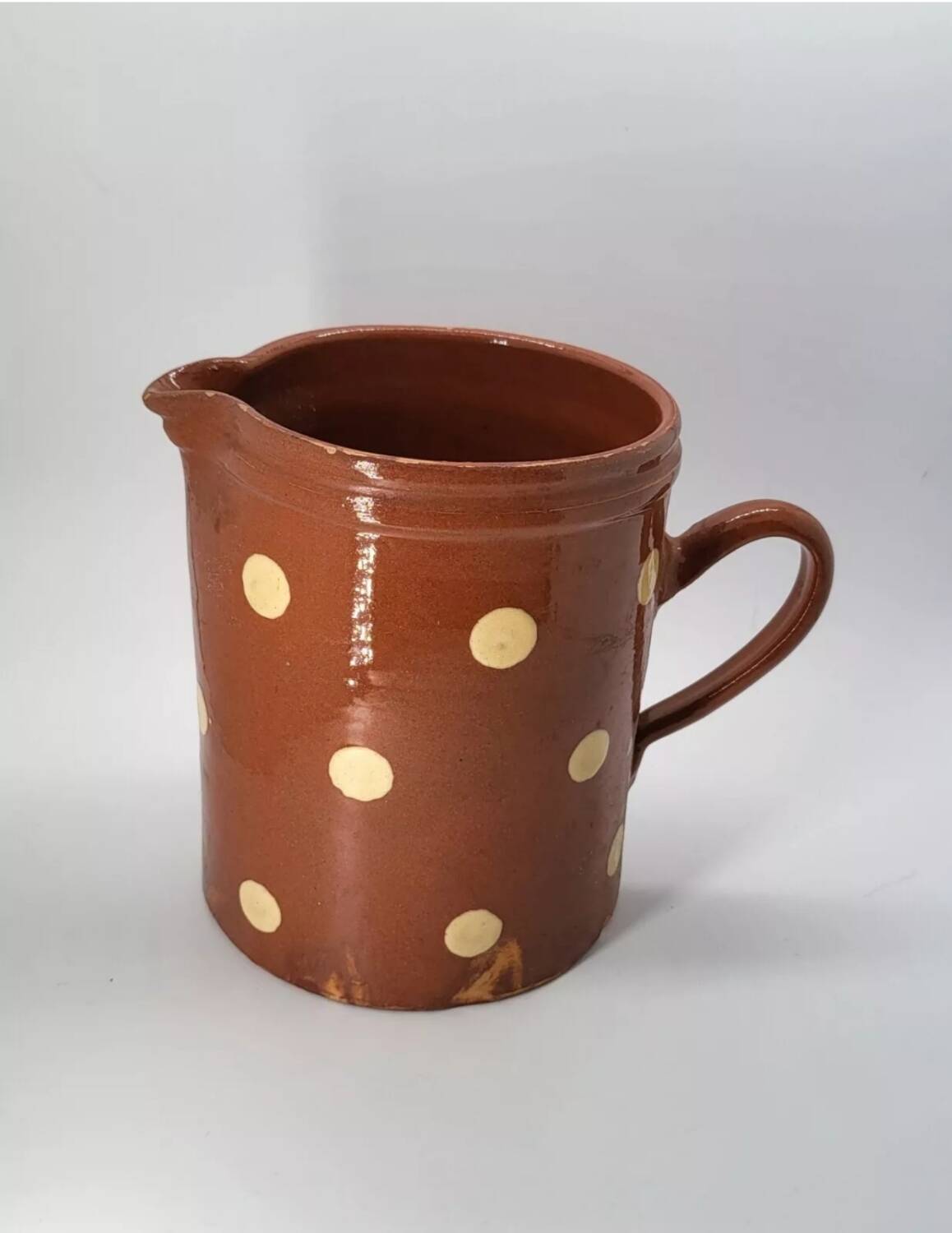Old pitcher with polka dots savoyard pottery in glazed terracotta alsace