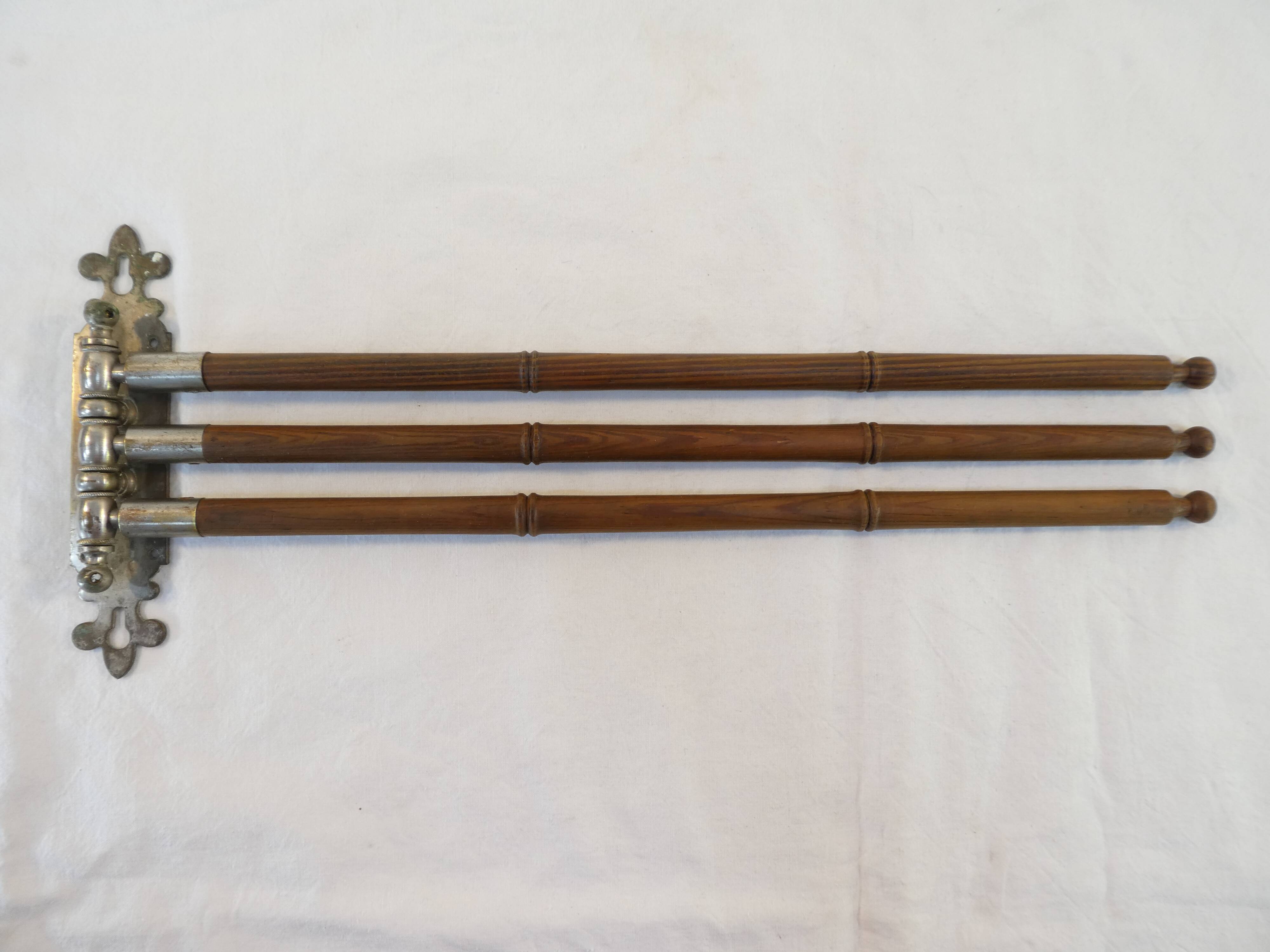 Antique towel rack has three arms