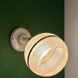 Vintage globe wall light in frosted yellow and gold glass.