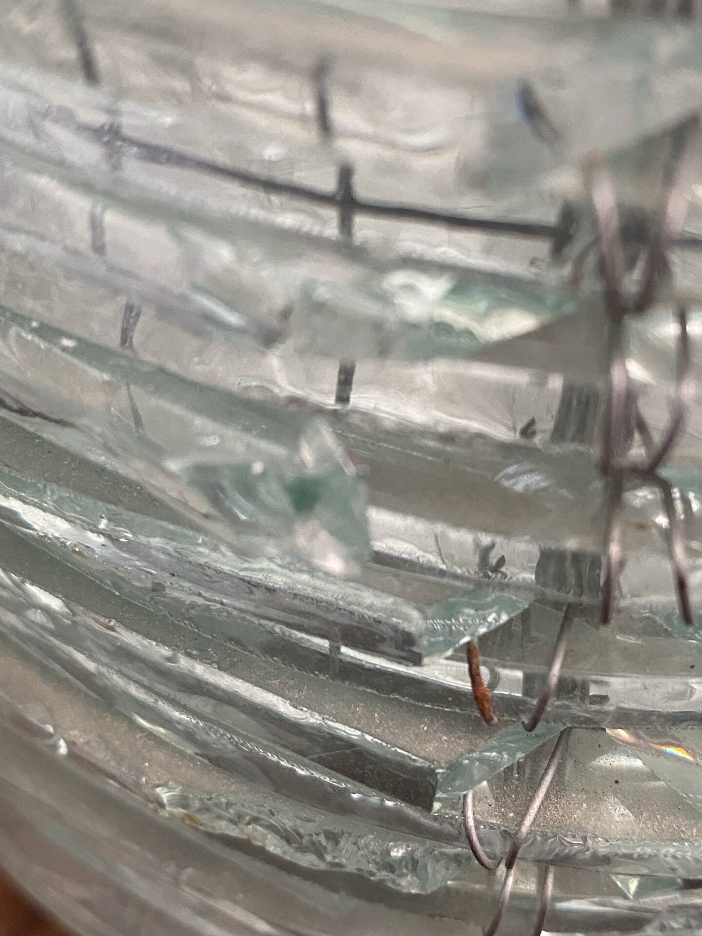 Blue-tinted glass lamp and wire.