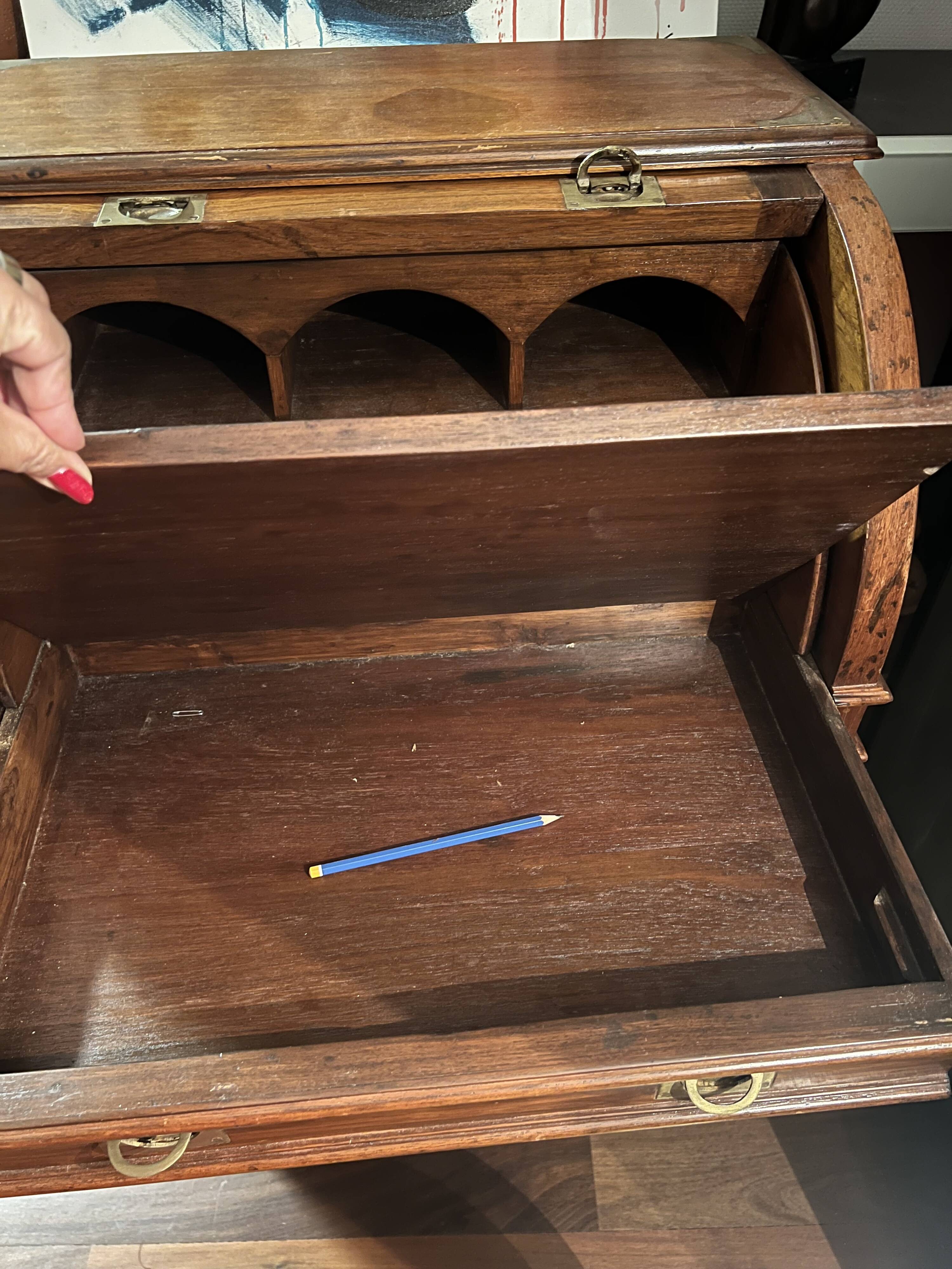 Antique solid wood secretary with a drop-down cylinder compartment.