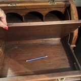 Antique solid wood secretary with a drop-down cylinder compartment.