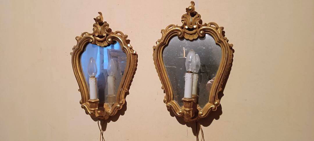 Vintage gold mirror sconces from the late 1950s.