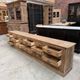 Large workshop furniture transformed into a TV unit.
