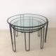 Set of three coffee tables black glass in the middle of the century with legs and metal hairpin