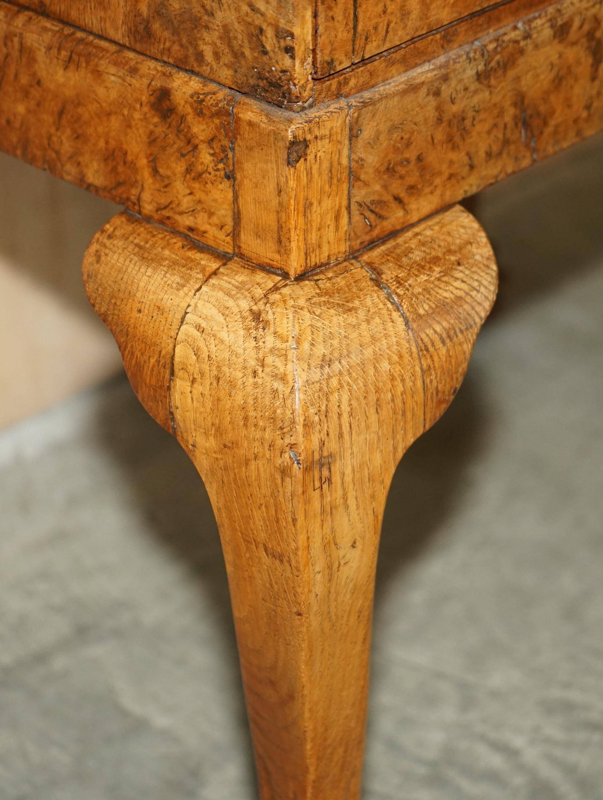 Writing desk in pollard oak from around 1800 with claw and ball carved legs.