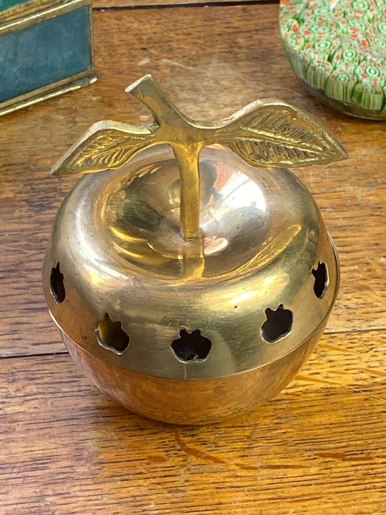 Bonbonnière, in the shape of an apple, made of brass.