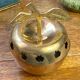 Bonbonnière, in the shape of an apple, made of brass.