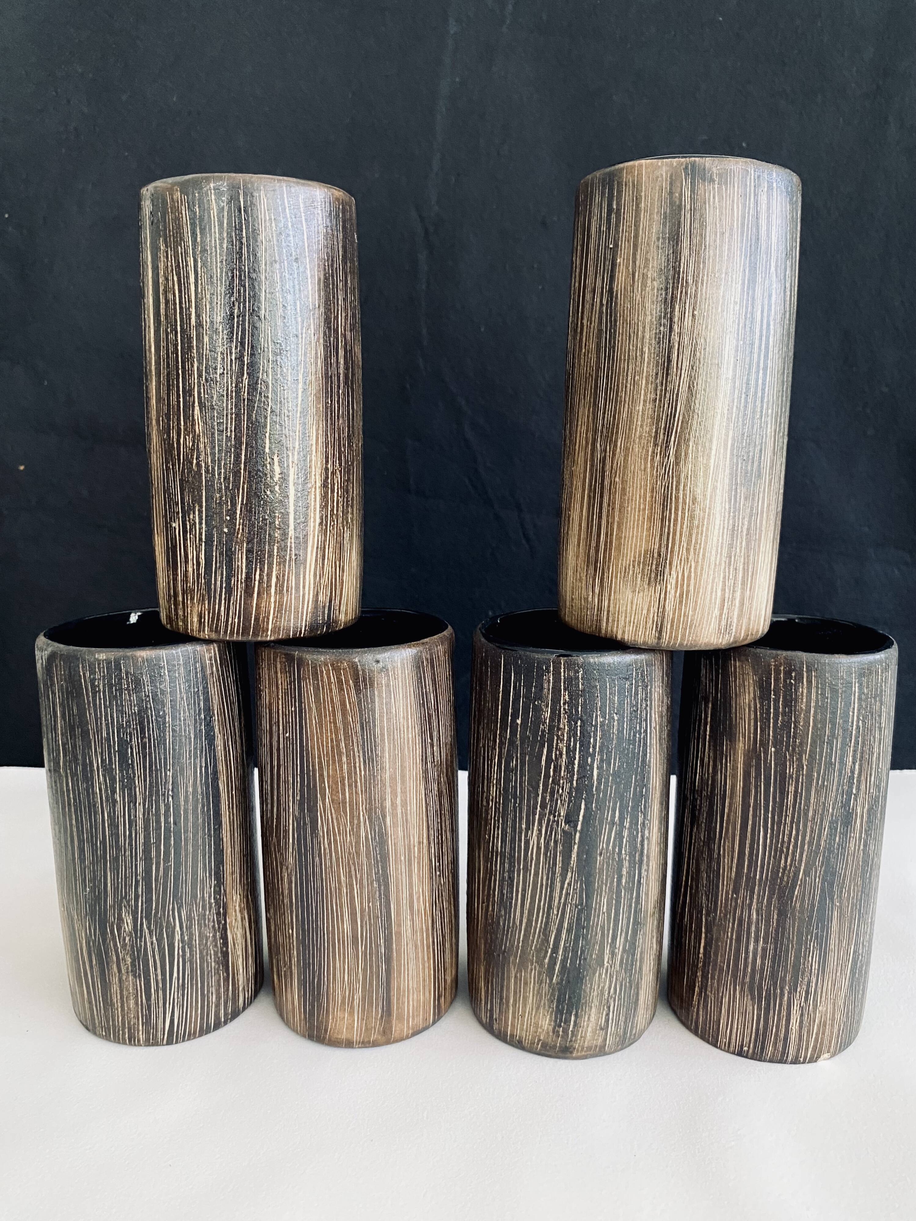 Six terracotta glasses, matt and glazed