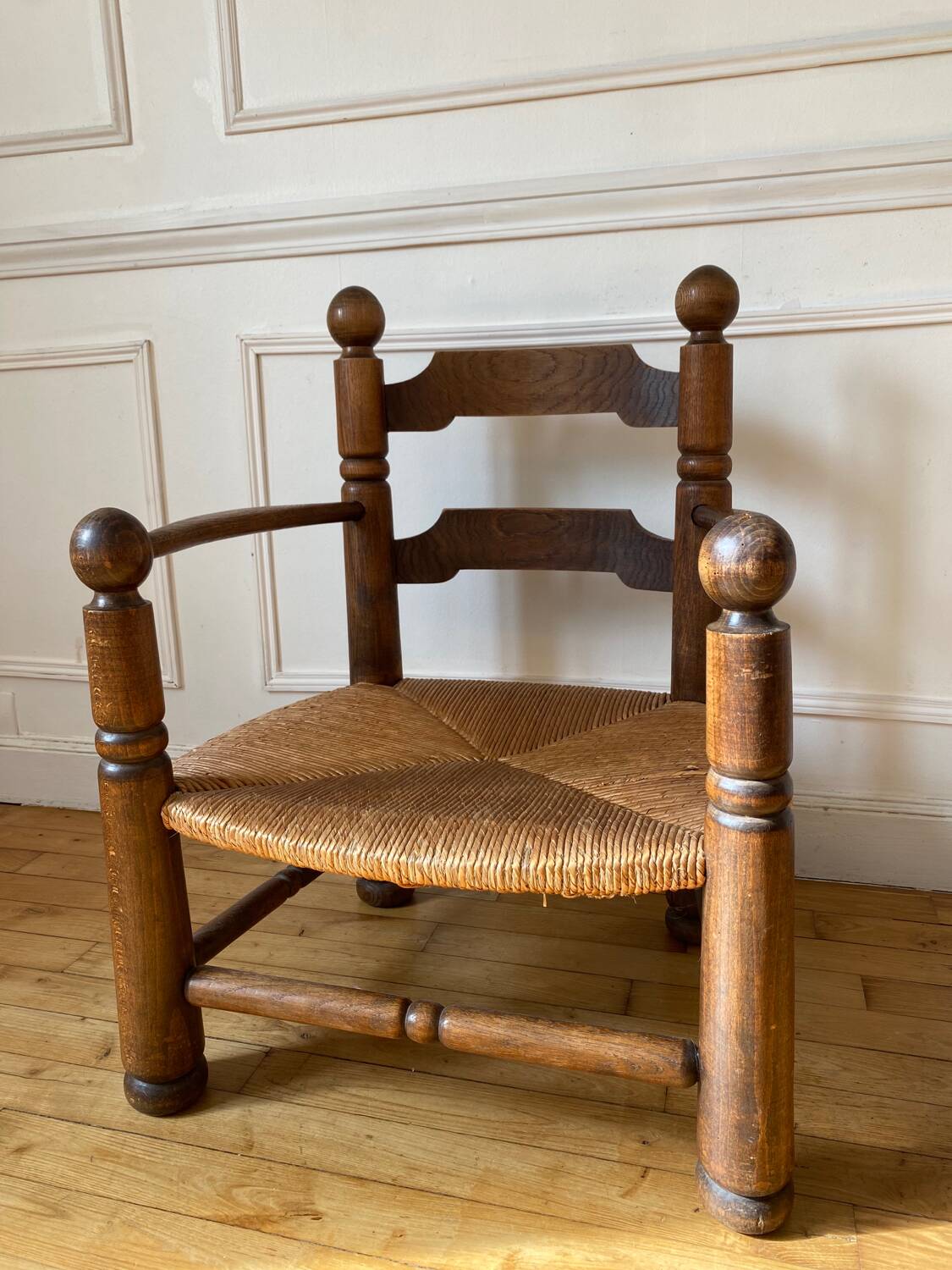 Straw and turned wood fireplace armchair in the style of Charles Dudouyt