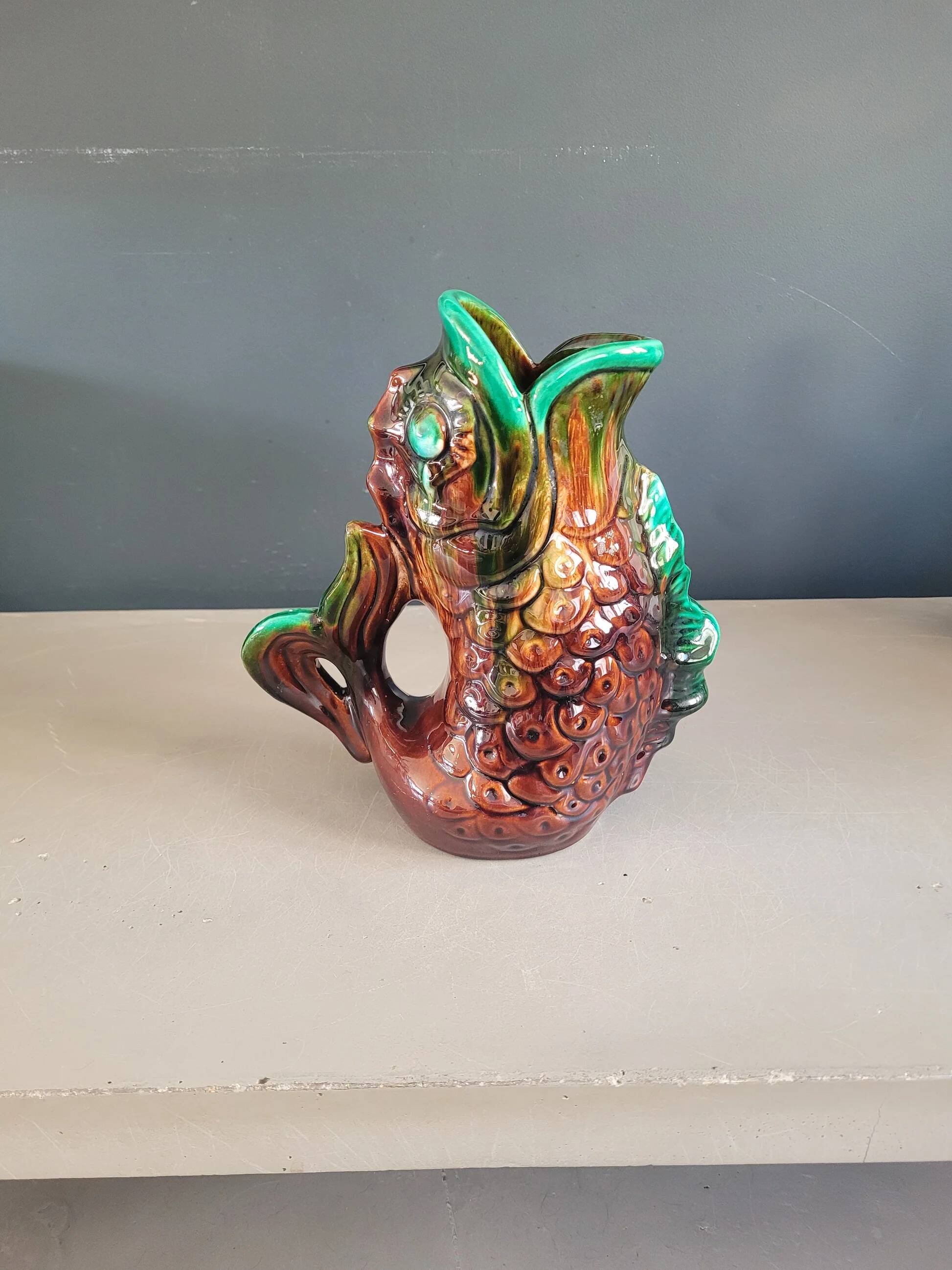 Old ceramic fish jug